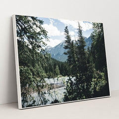 Snow-Capped Rocky Mountains and Evergreen Forest by River in Banff by Ali Kazal - White Frame Stretchiez
