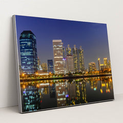 Nighttime Bangkok's Riverfront Skyline by Anonymous - Silver Frame Stretchiez