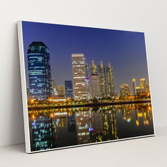 Nighttime Bangkok's Riverfront Skyline by Anonymous - White Frame Stretchiez