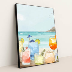 Coastal Sips features colorful summer cocktails on a beach with waves, displayed in a black frame.