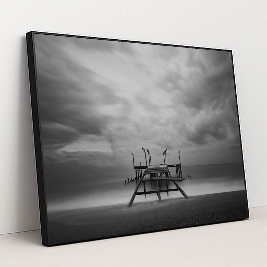 Lonely Pier Under Cloudy Skies by Engin Akyurt - Black Frame Stretchiez