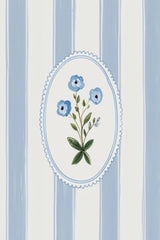 This artwork features a blue floral motif in an oval frame over vertical blue and white stripes.