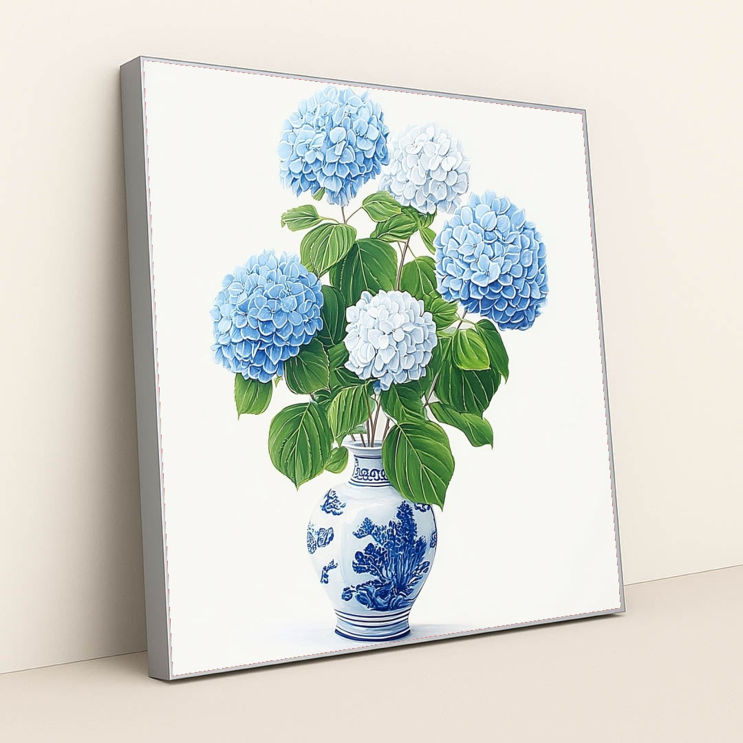 This artwork features a bouquet of blue and white hydrangeas in a blue and white porcelain vase, in a silver frame.