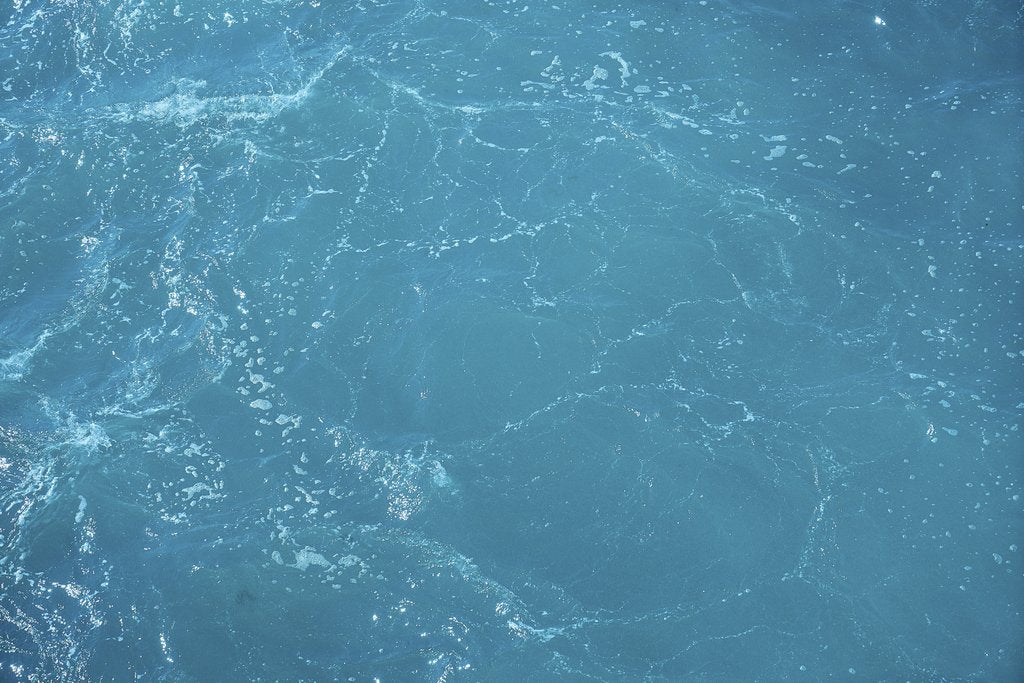 Engin Akyurt - A detailed and vibrant view of turquoise ocean water with light reflections.