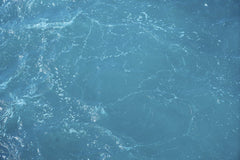 Engin Akyurt - A detailed and vibrant view of turquoise ocean water with light reflections.