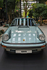 Porsche 911 Resting on a Quiet Street, showcasing classic design in a serene outdoor setting, ideal car wall art.