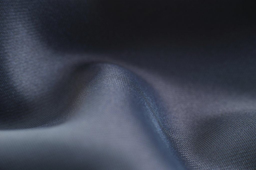 Engin Akyurt - Close-up view of blue fabric showcasing smooth texture and soft wave patterns.
