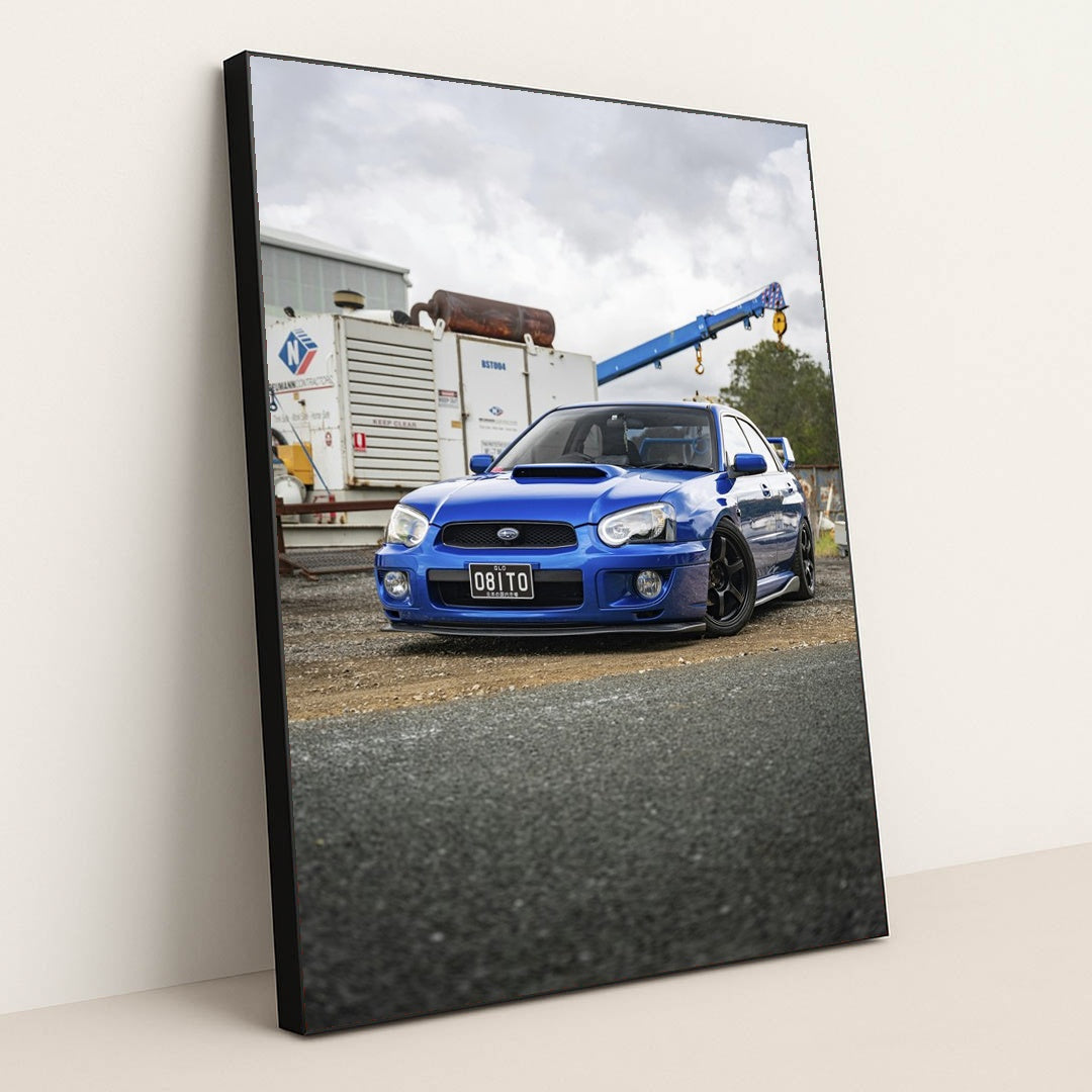 Blue Subaru WRX STI in Industrial Setting by Martynas Linge - Black Frame Stretchiez