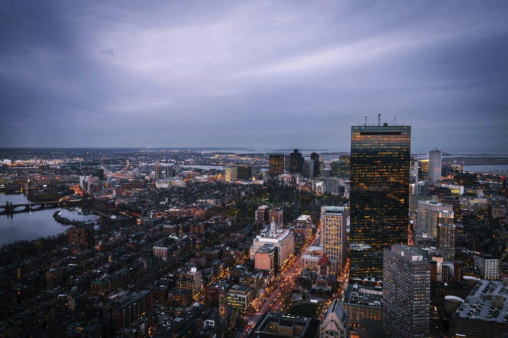 Andrés García - Stunning aerial view of Boston skyline at dusk, showcasing urban architecture and city lights.