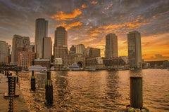 Mohan Nannapaneni - Stunning sunset over Boston's iconic skyline reflecting in the harbor waters.