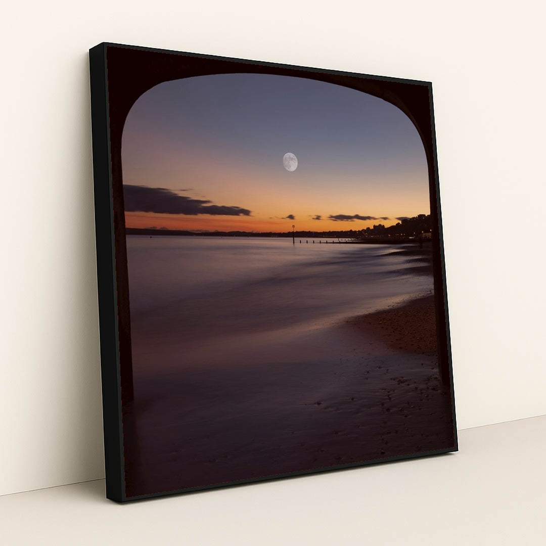 Moonlit Evening View Under Bournemouth Pier with Illuminated Coastline by Mohammad Abbasi - Black Frame Stretchiez