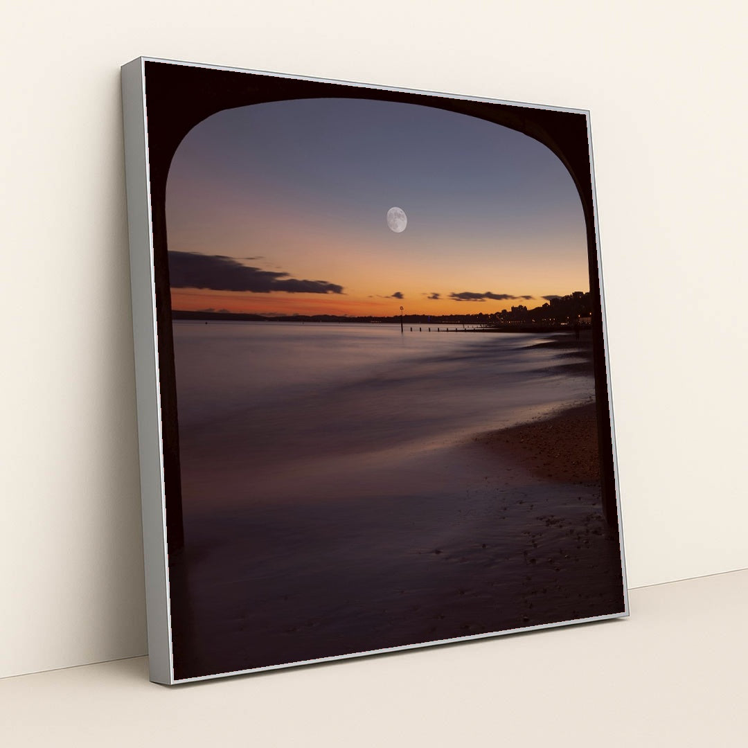 Moonlit Evening View Under Bournemouth Pier with Illuminated Coastline by Mohammad Abbasi - Silver Frame Stretchiez