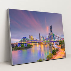 Sunset Serenity: Brisbane Skyline and River View by Anonymous - Silver Frame Stretchiez