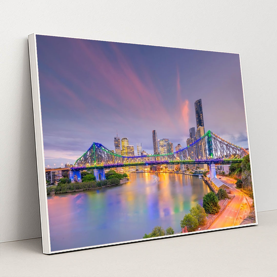 Sunset Serenity: Brisbane Skyline and River View by Anonymous - White Frame Stretchiez