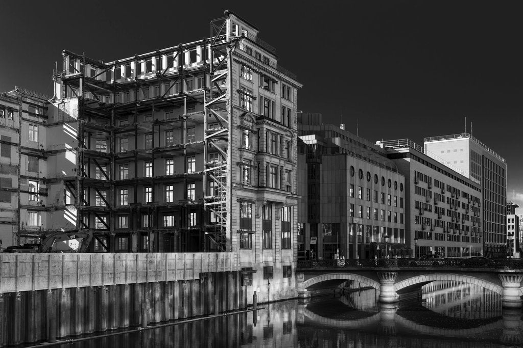 Wolfgang Weiser - Grayscale view of historical and modern architecture along a Hamburg canal.