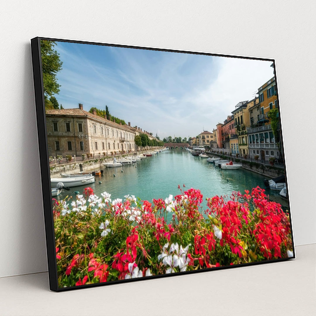 Flower-Lined Canal in an Italian Town by Getty Images - Black Frame Stretchiez
