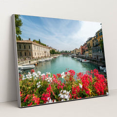 Flower-Lined Canal in an Italian Town by Getty Images - Silver Frame Stretchiez