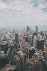 Guillermo  Arroyo - A breathtaking aerial view of Chicago's skyline featuring iconic skyscrapers under a bright sky.