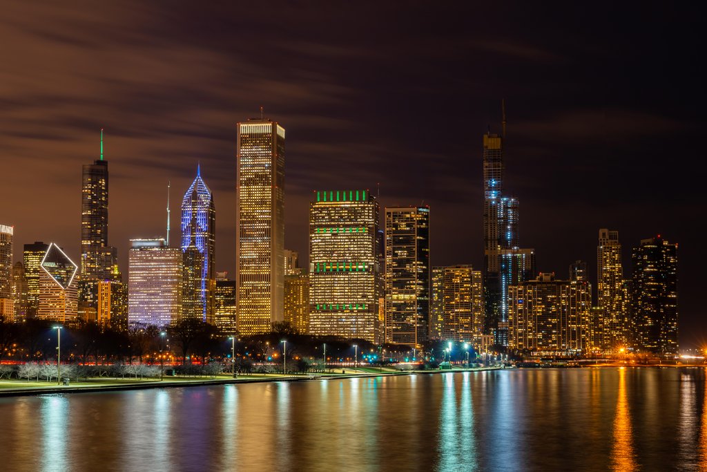 Sunset Reflections: Chicago's Urban Skyline Over Lake Michigan by Anonymous