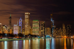 Sunset Reflections: Chicago's Urban Skyline Over Lake Michigan by Anonymous