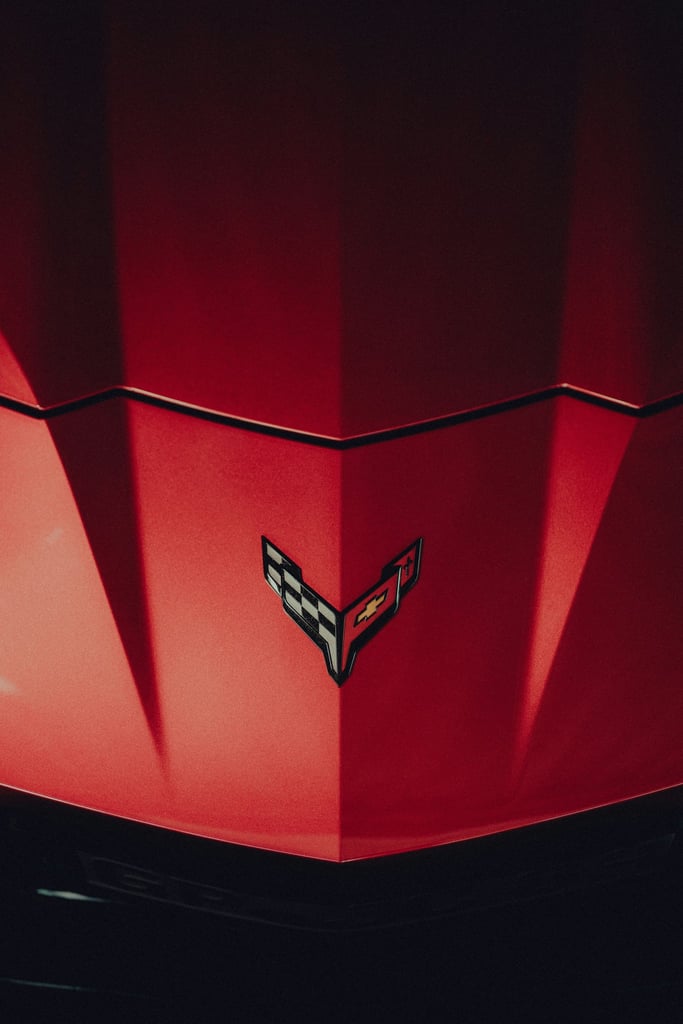 Close-Up of a Red Corvette Hood by Marcel Strauß