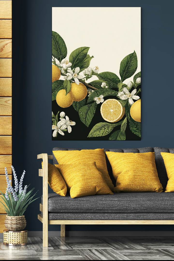 Decorative painting of lemons and flowers on a wall above a sofa with yellow cushions.