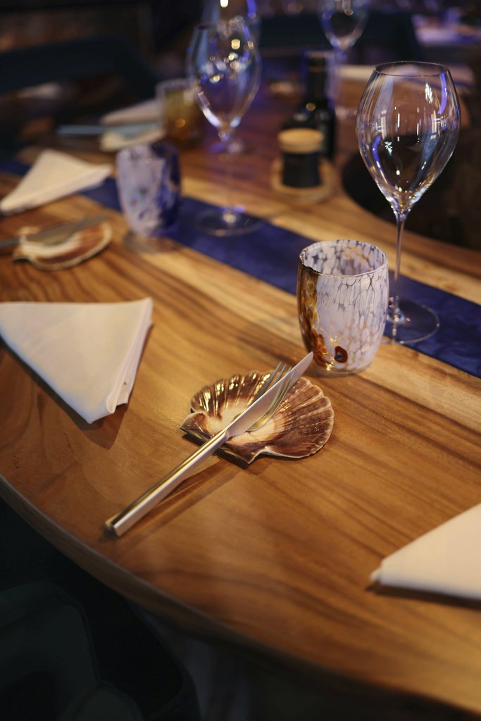 Valeria Boltneva - Sophisticated dining table with elegant glassware and napkins, perfect for upscale events.