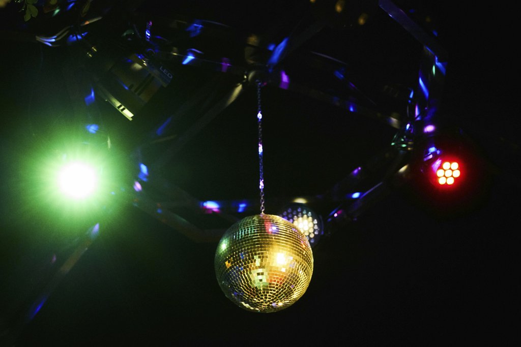 Engin Akyurt - A vibrant disco ball reflecting multicolored lights in a lively club setting, perfect for party themes.