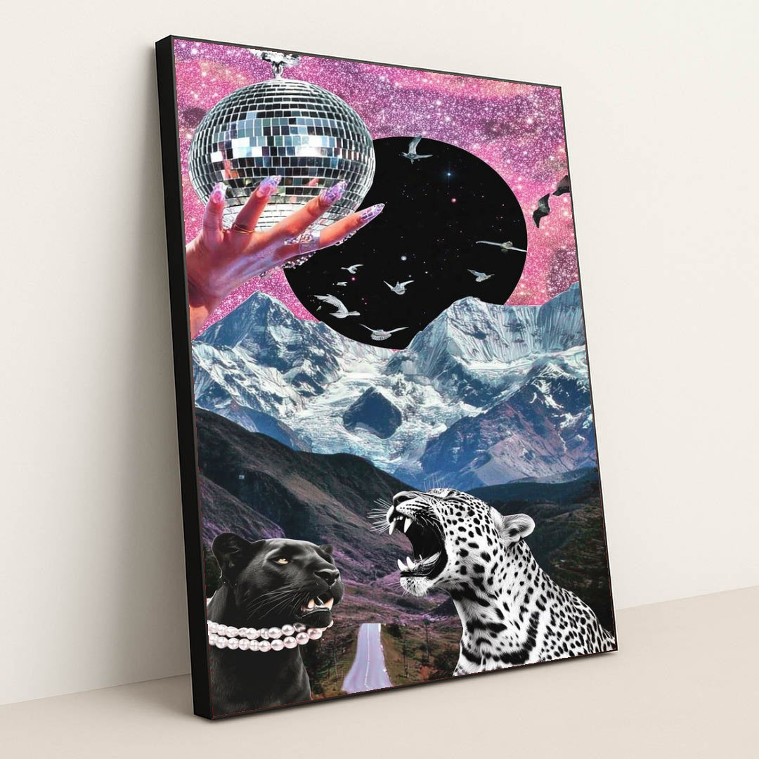 This artwork shows a surreal collage of a jeweled hand holding a disco ball, starry sky, soaring birds, snowy mountains, and two leopards, in a black frame.
