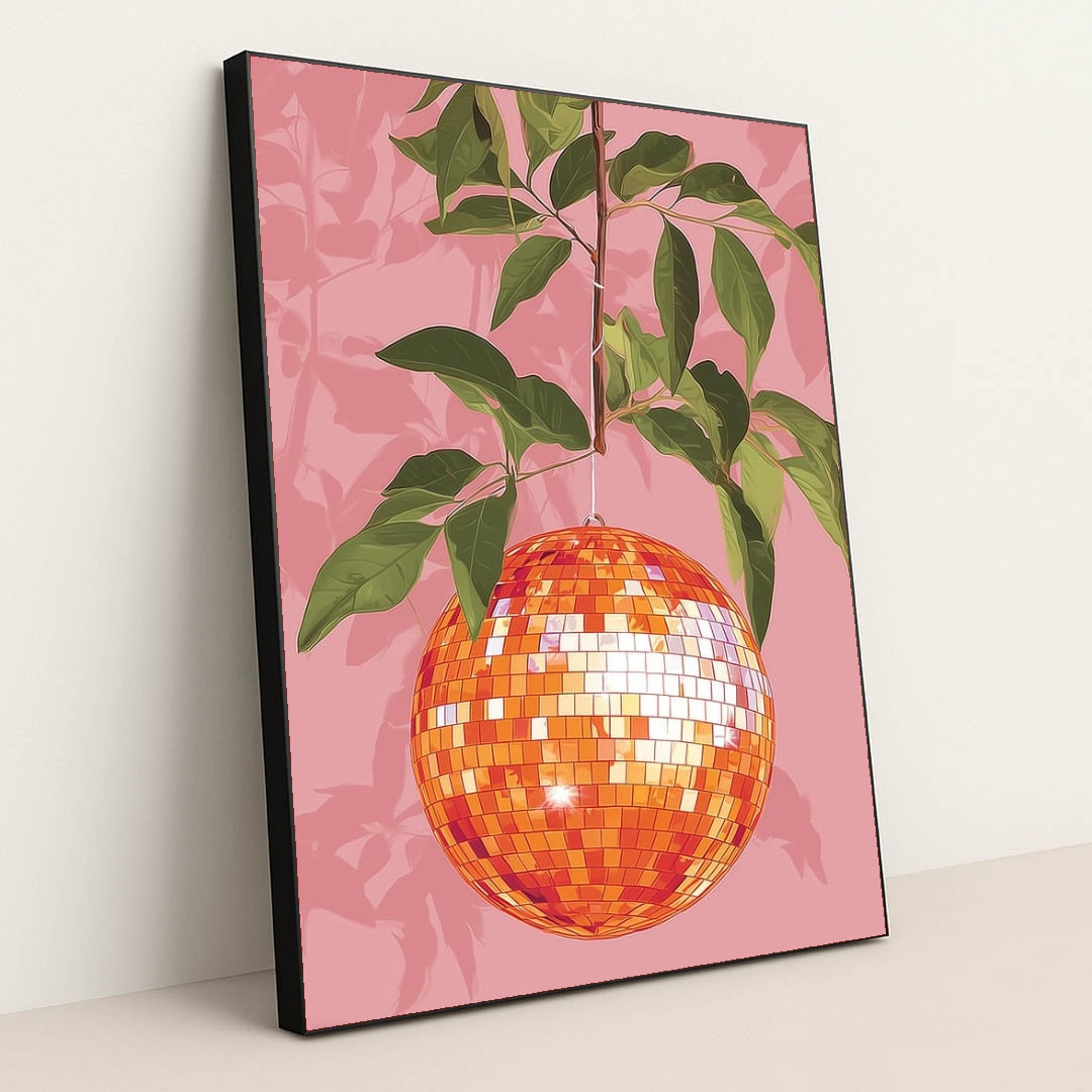 This artwork shows an orange disco ball hanging from a leafy branch against a pink background, in a black frame.