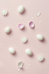 DS stories - Aesthetic flat lay with eggshells and flower accents on a pastel pink background. Perfect for Easter themes.