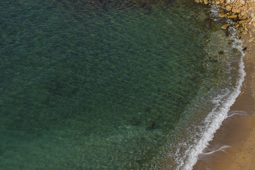 Engin Akyurt - Beautiful aerial view of clear turquoise water meeting a sandy beach. Ideal for travel and nature themes.