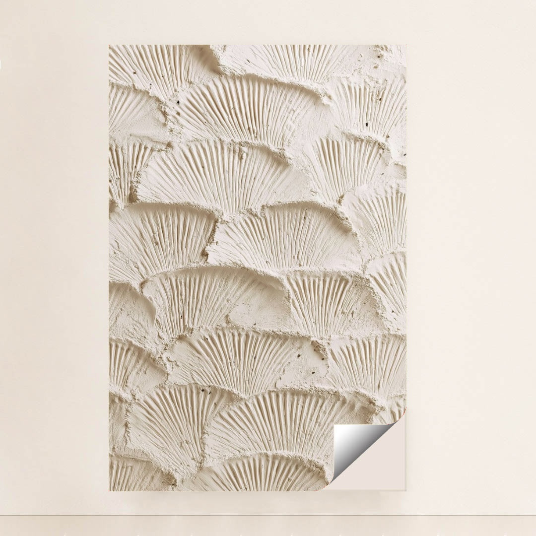 This artwork features overlapping fan-shaped textured cream plaster scales, unframed.