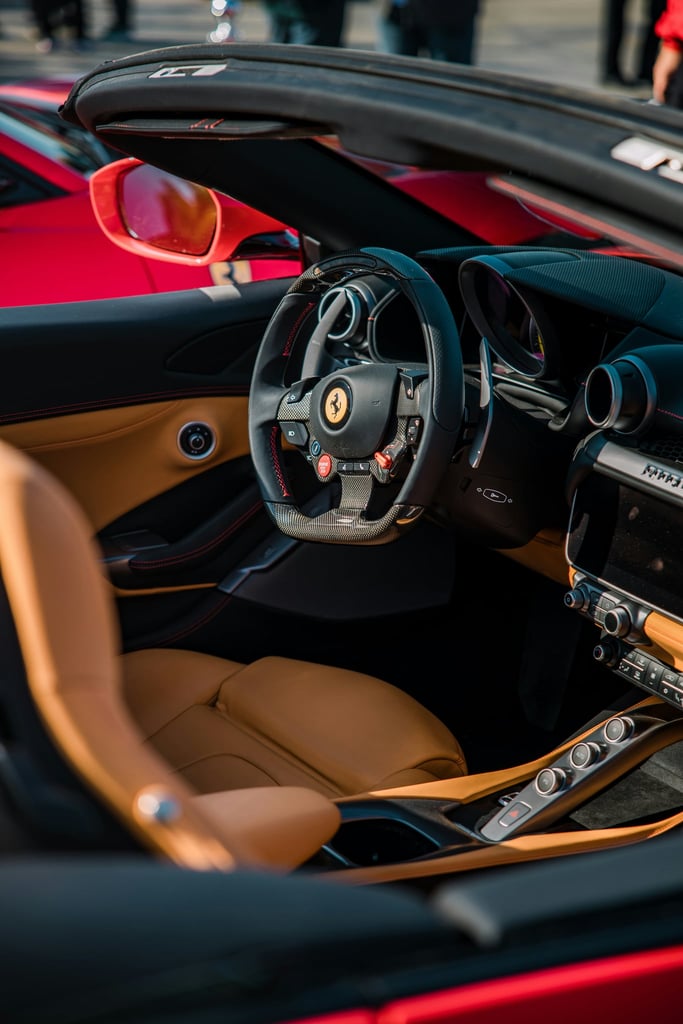 Ferrari Interior Detail featuring rich tan leather seats, flat-bottomed steering wheel, and sleek dashboard in car wall art.