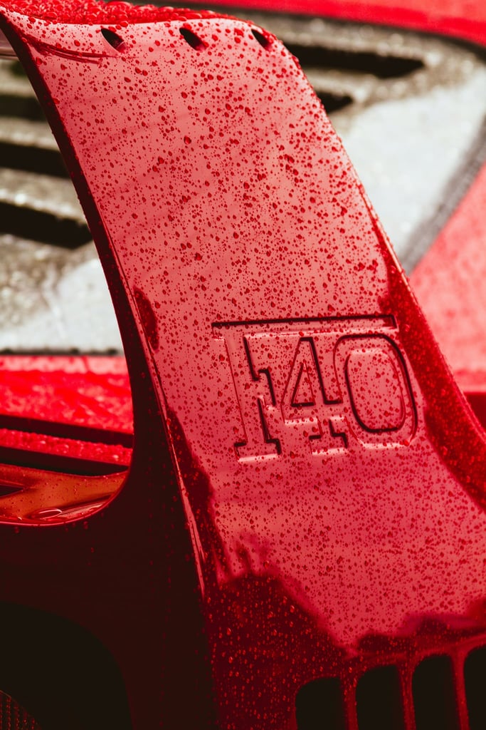 Close-up of the Ferrari F40 Wing with water droplets, showcasing car wall art and the iconic embossed 'F40' detail.
