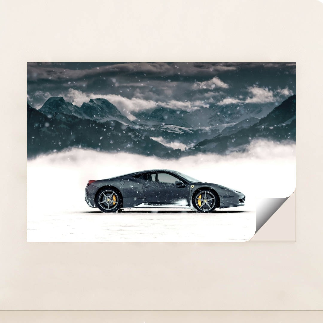 This photo shows a black Ferrari coupe parked in snow with snowy mountains in the background, minimalist unframed style.