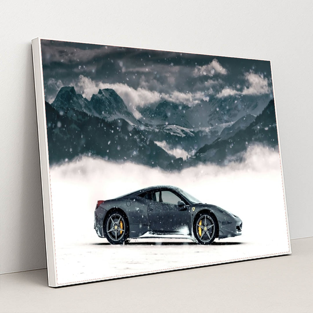 This photo shows a black Ferrari coupe parked in snow with snowy mountains in the background, in a white frame.