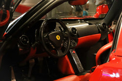 Ferrari Cockpit in Red and Black showcases luxurious red and black interior, perfect for car wall art enthusiasts.