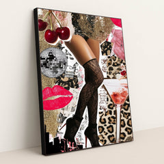This artwork shows a collage of glam legs in fishnet stockings and high heels, cherries, kisses, disco ball, martini, and gold glitter, in a black frame.