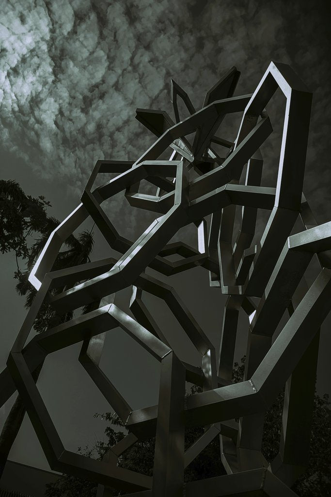 Moon Bouy - Futuristic metal sculpture in an urban setting, photographed with a low angle view.