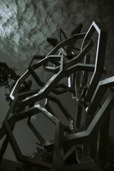 Moon Bouy - Futuristic metal sculpture in an urban setting, photographed with a low angle view.