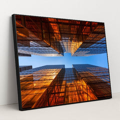 Golden Glass Towers Reflecting Sunset Against Clear Blue Sky by Anonymous - Black Frame Stretchiez