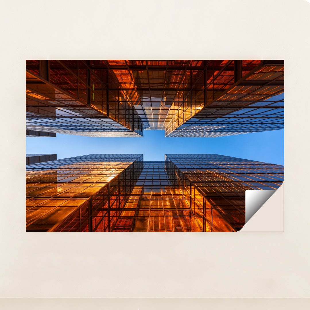 Golden Glass Towers Reflecting Sunset Against Clear Blue Sky by Anonymous - Peeliez