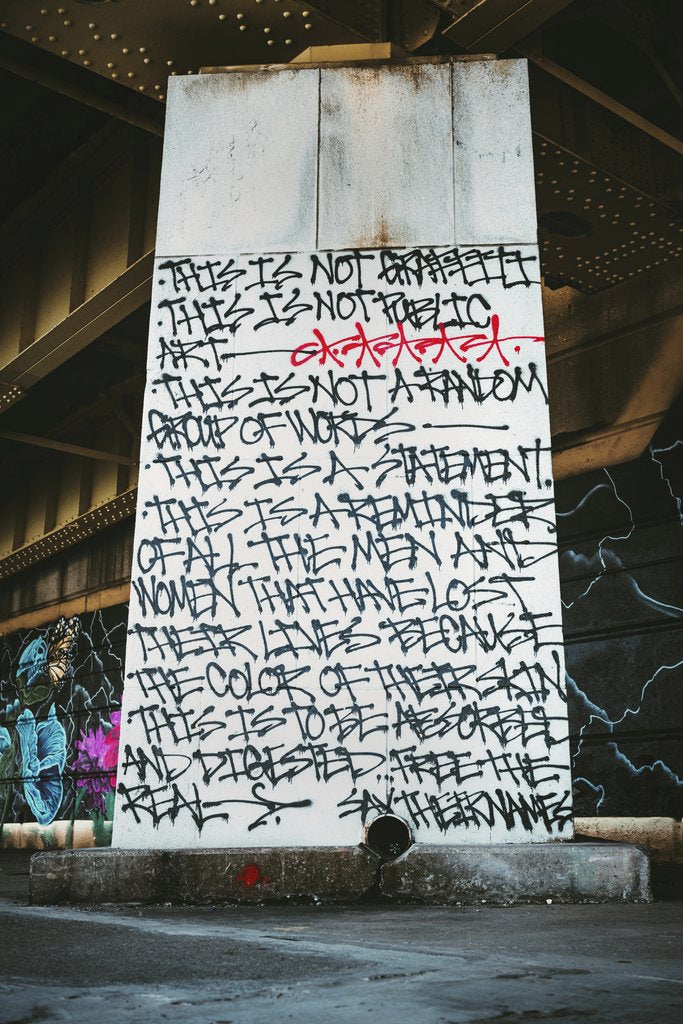 Tim Mossholder - Graphic street art covering a wall under a bridge in Pittsburgh, USA.