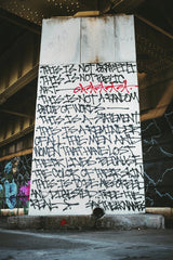 Tim Mossholder - Graphic street art covering a wall under a bridge in Pittsburgh, USA.