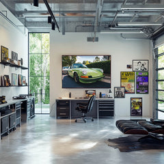 Classic Porsche 911 in Light Green displayed in a modern office with sleek furniture and vintage car wall art.