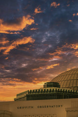Dimitri Baret - Stunning view of Griffith Observatory against a vibrant sunset sky, capturing architectural elegance.
