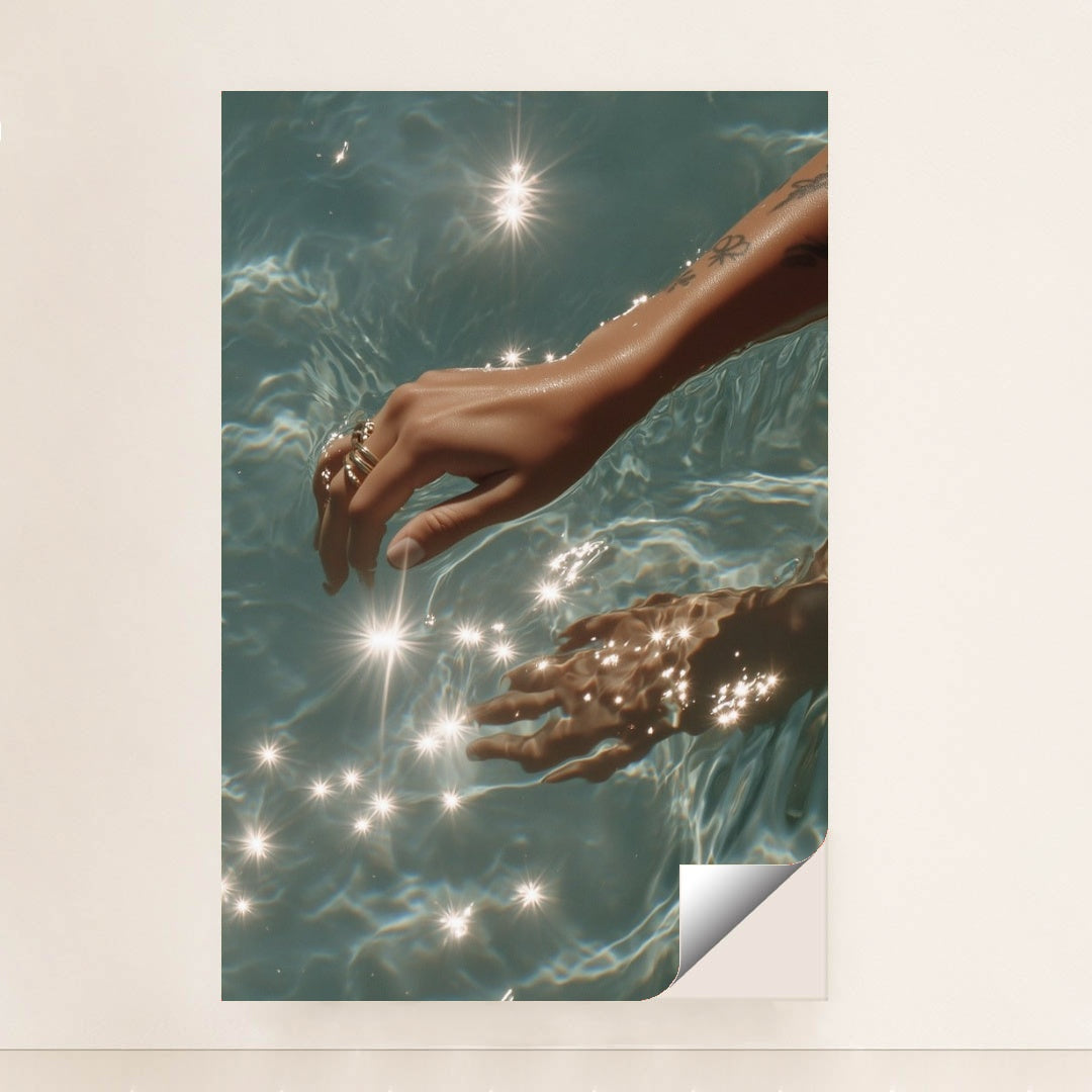 This artwork features a hand with rings reaching into sparkling blue water, unframed.