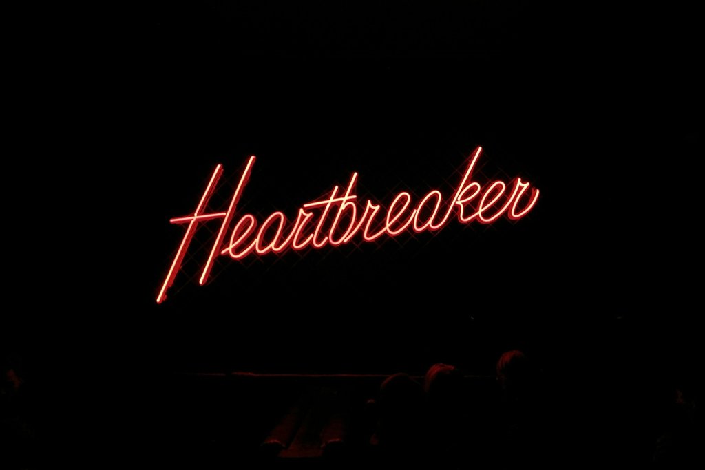 Matthew Kwong - Heartbreaker neon signage on black background photo