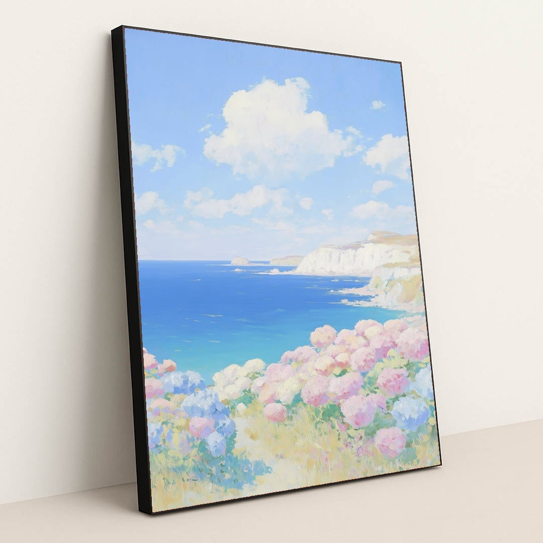 This artwork features a pastel coastal landscape with hydrangea flowers and blue sea cliffs, in a black frame.